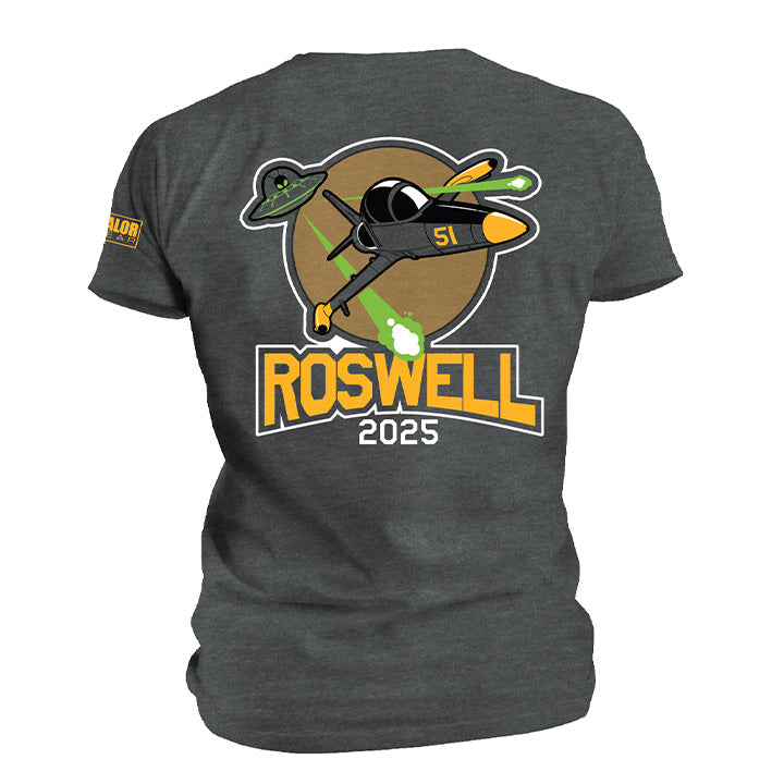 Roswell 2025 charcoal gray T-shirt featuring a vintage fighter plane, UFOs, and green alien beams graphic.